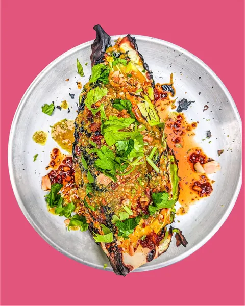 Grilled hispi cabbage, amba curry sauce, coriander, kimchi and peanut