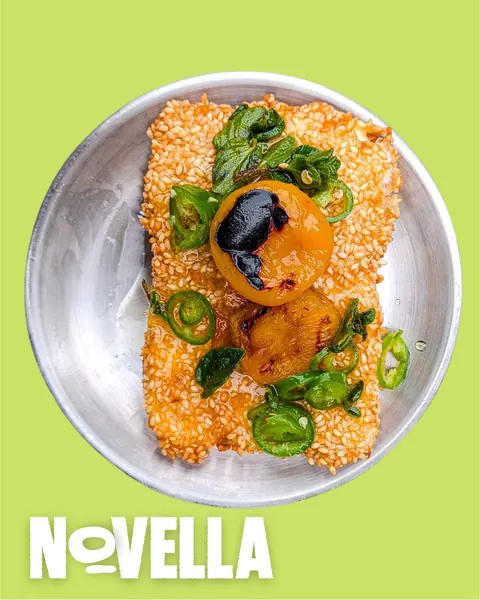 Sesame-crusted feta topped with charred apricot and green chilli