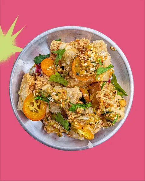 Super crispy tofu with chilli caramel, spring onion and kumquat